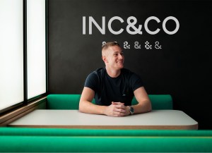 Jack Mason in front of Inc & Co sign